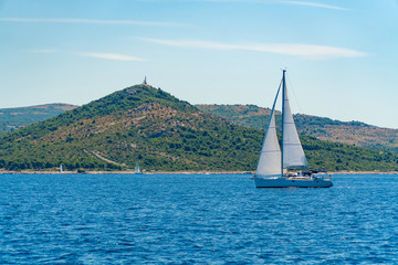 Lonely Yacht sailing on opened sea, Croatia