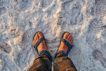 young man is a traveler on the shore of the salty Lake Maharlu in Iran, Fars Province near Shiraz...