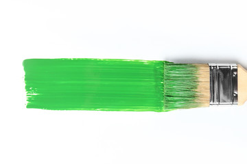 Brush with paint stroke on white background