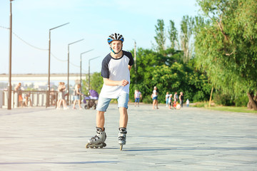 Teenage boy on roller skates outdoors