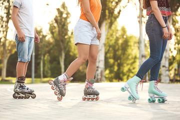Teenagers on roller skates outdoors