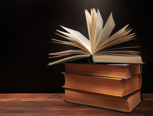 Open book on the blackboard background.