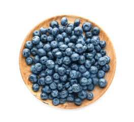 Plate with ripe blueberry on white background