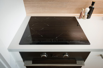 Electric stove with induction cooktop in contemporary kitchen