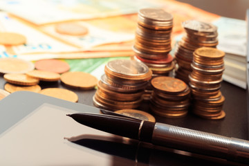 Financial business concept combination with coins, money, calculator and pen