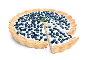 Tasty bilberry pie on white background