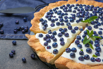 Tasty bilberry pie on grey background, closeup
