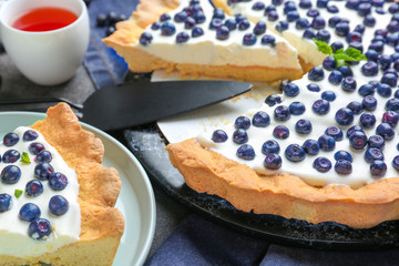 Tasty bilberry pie on table, closeup