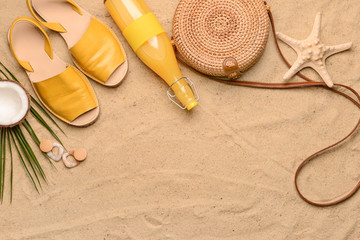 Composition with beach accessories on sand