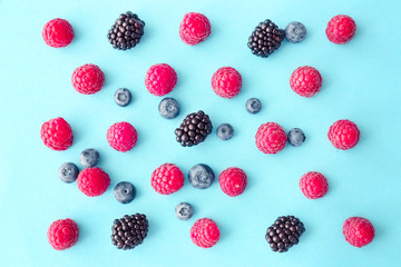 Sweet ripe berries on color background