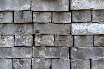 old dirty used gray bricks. Close up.
