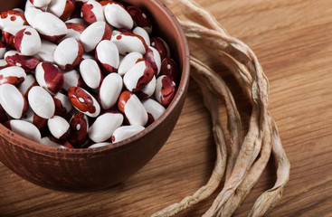 Ripe grain beans on a light background.
