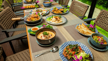 Breakfast on the table is bacon, fried egg, coffee, tea, bread.