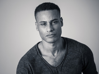 Fototapeta premium Fashion portrait of Attractive african american male model posing happy and sexy for the camera