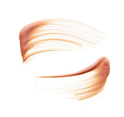 Gently beige strokes and texture of face highlighter or acrylic paint isolated on white background