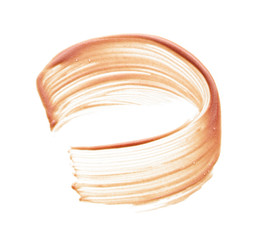 Gently beige strokes and texture of face highlighter or acrylic paint isolated on white background