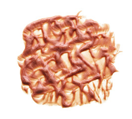 Gently beige strokes and texture of face highlighter or acrylic paint isolated on white background