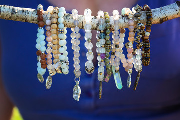 Collection of mineral stone beaded bracelets on natural outdoor background - 280157442
