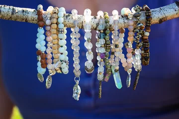 Collection of mineral stone beaded bracelets on natural outdoor background © marbenzu