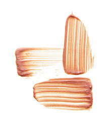 Gently beige strokes and texture of face highlighter or acrylic paint isolated on white background