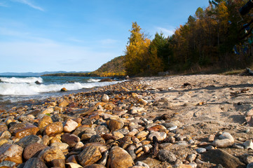 Ust-Barguzin Russia, sand and pebble beach on Lake Baikal in autumn