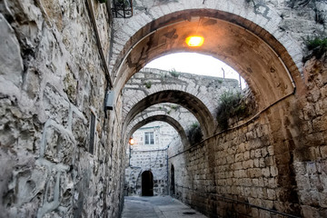 Narrow stone street in the Jewish Quarter in Old City of Jerusalem, Israel. April 2013