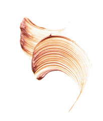 Gently beige strokes and texture of face highlighter or acrylic paint isolated on white background