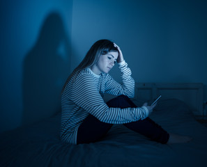 Depressed child victim of the dangers of internet and smart phone addiction.