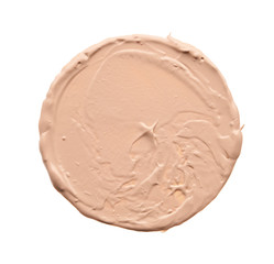 Gently beige strokes and texture of face highlighter or acrylic paint isolated on white background