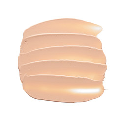 Gently beige strokes and texture of face highlighter or acrylic paint isolated on white background