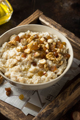 Oatmeal with nuts (hazelnuts, walnuts) and honey, porridge for Breakfast. Tasty, healthy food