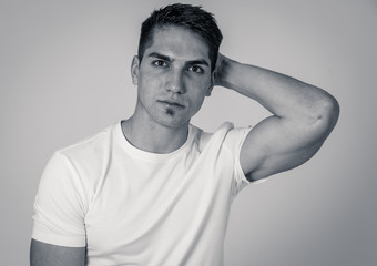 Obraz premium Fashion portrait of Attractive mixed race young man model posing happy and sexy for the camera