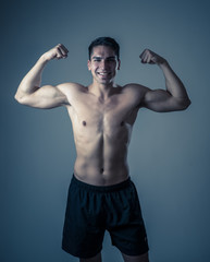Fototapeta na wymiar Portrait of strong healthy handsome Athletic man isolated on neutral background