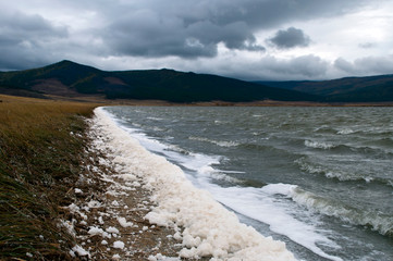 Barguzin Valley Russia, wind swept landscape with spume along water's edge