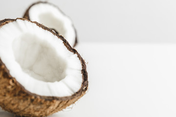 Ripe coconut pieces on white background, copy space