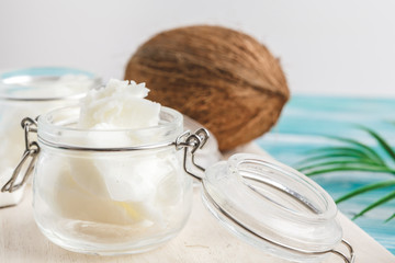Coconut butter on wooden background. Organic healthy food concept