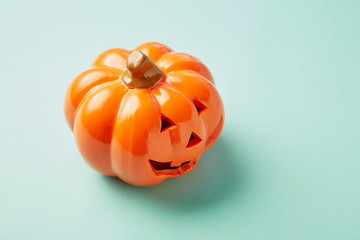 One Halloween Pumpkin on pastel blue background