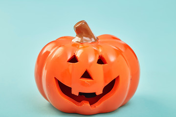 One Halloween Pumpkin on pastel blue background