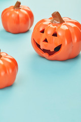 Glowing jack lanterns on pastel pale blue