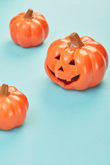 Glowing jack lanterns on pastel pale blue