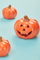 Glowing jack lanterns on pastel pale blue