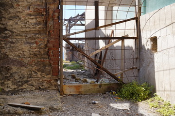 Grid and barrier at the lost place Argintiera, in Sardinia (Italy)