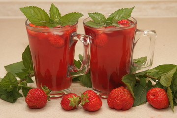 Strawberry juice with mint in two glasses, profile view