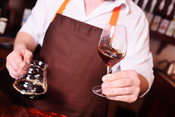 A professional barista prepares coffee using an alternative method of brewing.Drip coffee or pour-over coffee on the scale and professional coffee equipment.