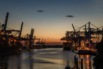 Fototapeta na wymiar Port of Hamburg Waltershof at sunset