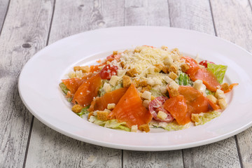 Caesar salad with salmon and parmesan