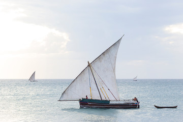 traditional dhow sailing boat transporting commodities between the islands and the mainland