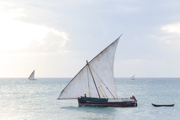 Fototapeta premium traditional dhow sailing boat transporting commodities between the islands and the mainland