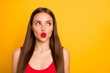 Close-up portrait of her she nice-looking attractive lovely winsome magnificent fascinating charming cute straight-haired lady looking aside kissing isolated over bright vivid shine yellow background