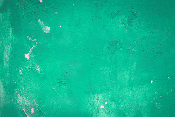 Abstract closeup green green cement wall background, blank crack old green paint wall